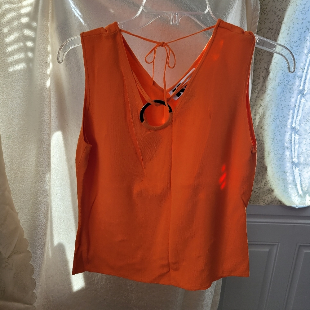 (1016) K Studio  Size L.  Orange Top